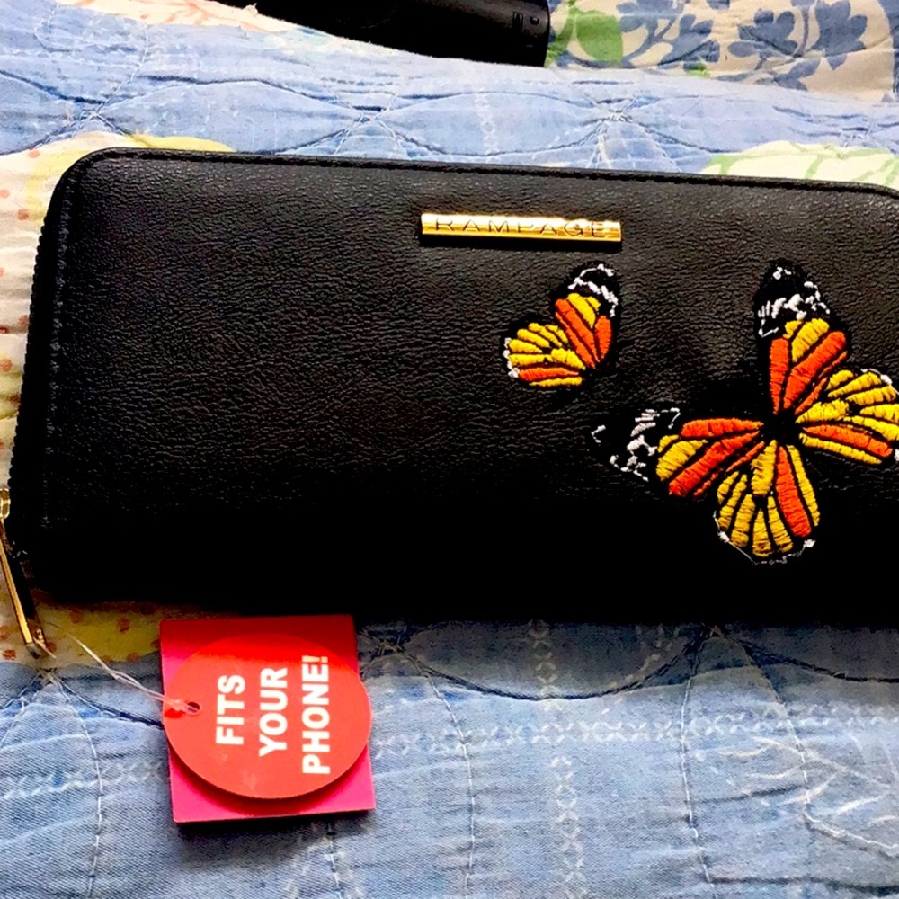 Brand new wallet with 2 compartments for coins, bills, credit cards and phone.